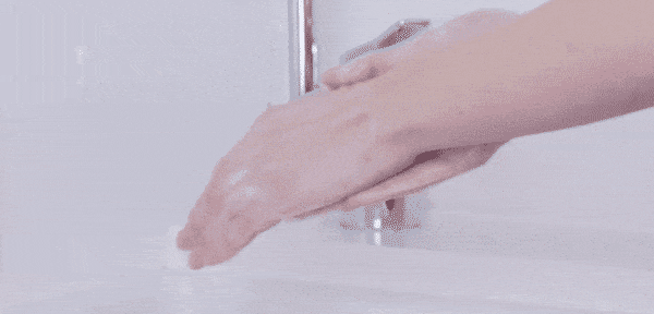 Washing hands before putting on contact lenses